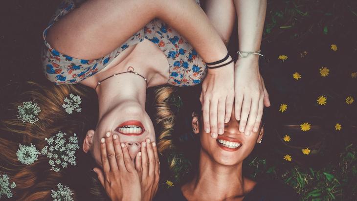 Two Friends Laughing Together